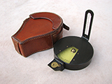 Prismatic inches per yard clinometer in fitted leather case